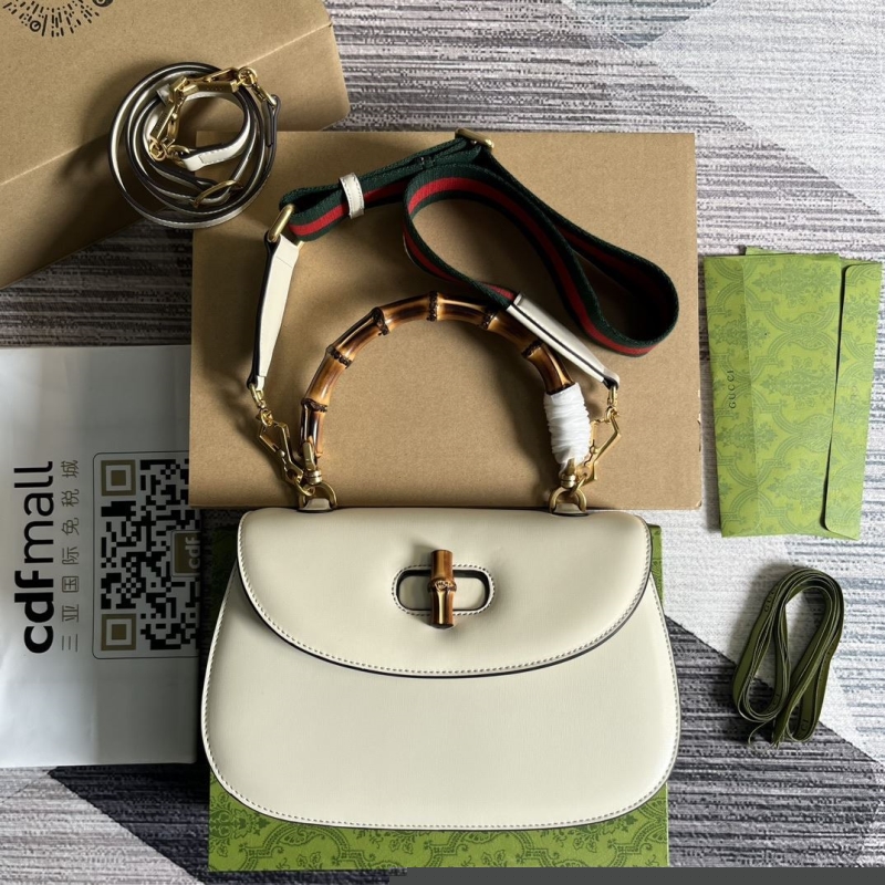 G*u*i top handle bags